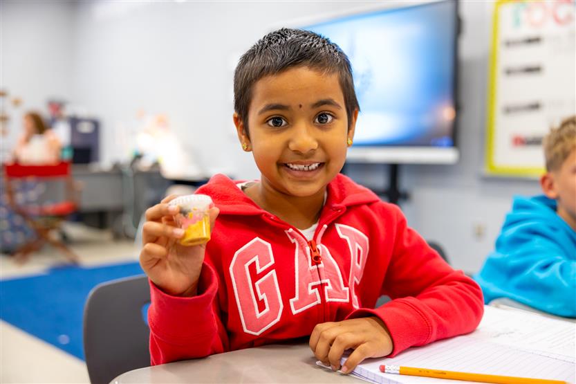 Students smile in science class